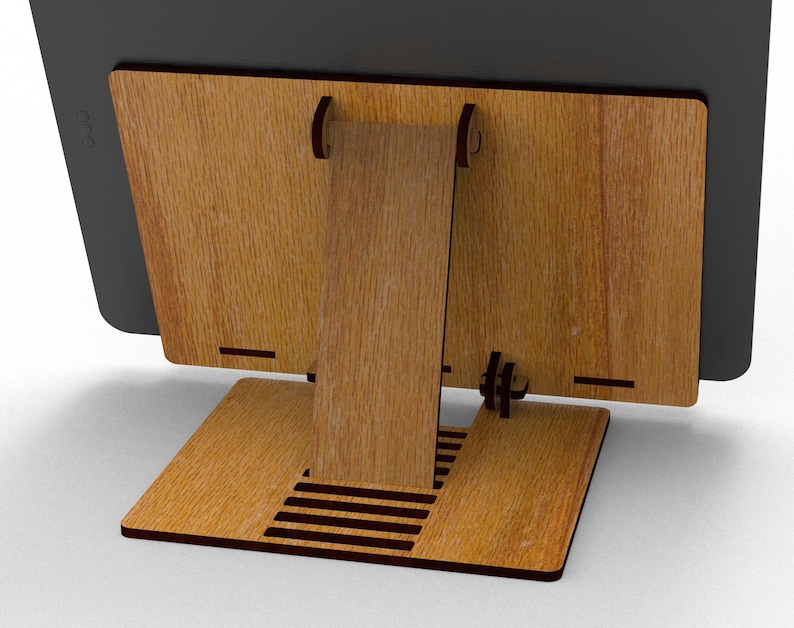 May include: A wooden tablet stand with a natural wood grain finish. The stand has a rectangular base, a vertical support, and a back panel to hold the tablet. The design features slots and cutouts for stability and cable management.
