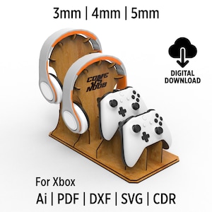 Peut inclure: Un fichier de téléchargement numérique pour un support d'écouteurs et de manette Xbox imprimé en 3D. Le support est en bois et comporte un emplacement pour deux manettes et un casque. Le support est disponible en trois tailles différentes : 3 mm, 4 mm et 5 mm. Le fichier est disponible aux formats AI, PDF, DXF, SVG et CDR.