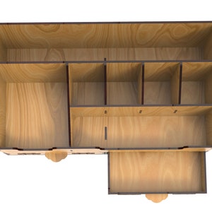 May include: A wooden organizer with multiple compartments and a drawer. The organizer is made of light brown wood with dark brown accents. The compartments are open and empty.