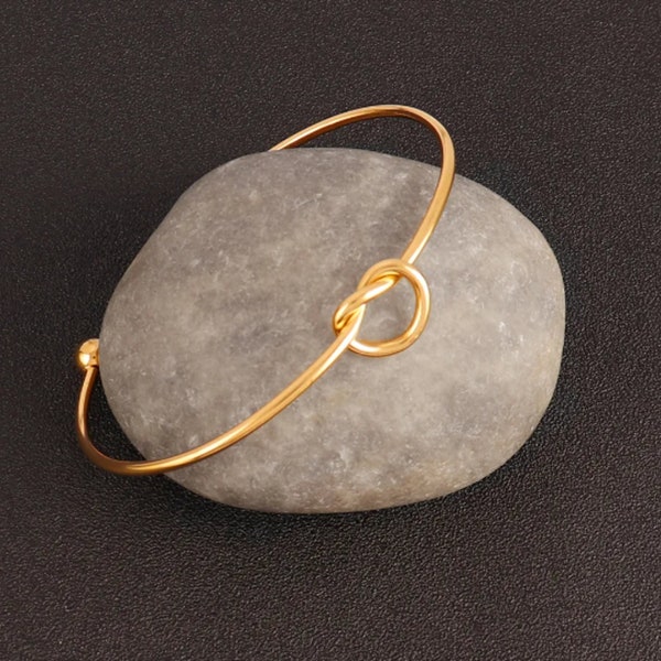 bracelet femme acier inoxydable bijou nœud d'amour manchette ouverte doré , argenté et rose gold cadeau St Valentin anniversaire Noel léger