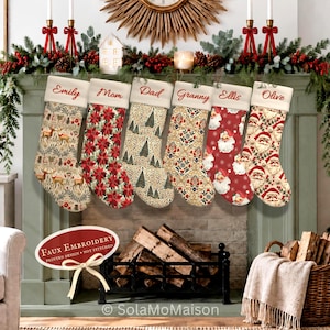 May include: Six Christmas stockings with white cuffs, each personalised with red script names: Emily, Mom, Dad, Granny, Ellis, and Olive. The stockings feature varied patterns including deer, poinsettias, pine trees, ornate floral motifs, and Santa faces.