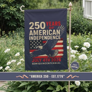 Patriotic garden flag celebrating 250 years of American independence displayed in a flower garden