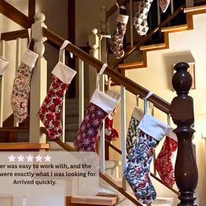 Customer photo of mix and match personalized large order Christmas stockings in different vintage holiday patterns hanging together on a staircase banister.