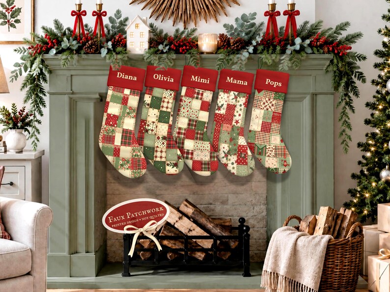 Five personalized patchwork style Christmas stockings in traditional red, green and cream hanging from a sage green fireplace mantel with festive holiday greenery.