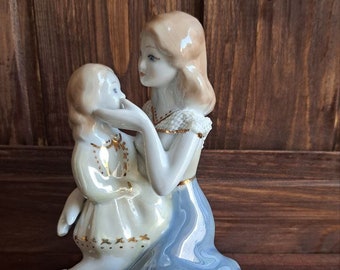 Vintage figurine “Woman with a child” Romanian porcelain