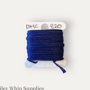 May include: A spool of DMC embroidery floss in a dark blue color, labeled with the number 820.