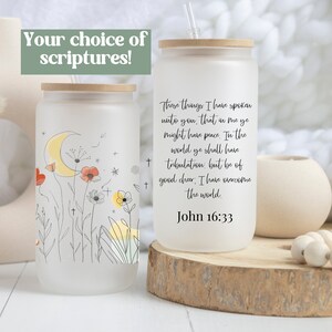 May include: Two frosted glass tumblers with bamboo lids and straws. One tumbler features a floral design with a crescent moon and the other has the text "These things I have spoken unto you, that in me ye might have peace. In the world ye shall have tribulation: but be of good cheer: I have overcome the world. John 16:33".