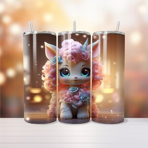 May include: Three stainless steel insulated tumblers with a whimsical unicorn design. The unicorn has pink curly hair, blue eyes, and is adorned with blue flowers. Each tumbler has a clear lid and a silver straw. The background is blurred with warm tones.