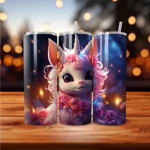May include: Three stainless steel tumblers with a whimsical unicorn design. The unicorn has pink fur, a white horn, and is adorned with pink roses. Each tumbler has a clear straw and a dark blue background with bokeh lights.
