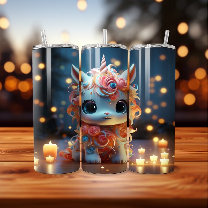May include: Three tall, cylindrical tumblers with a whimsical unicorn design. The unicorn has large blue eyes, a pink and orange mane, and a horn. The tumblers have a straw and are set against a blurred background with candles.