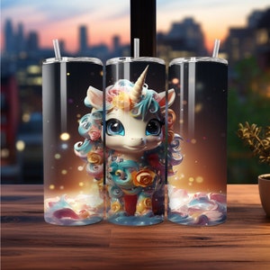 May include: Three stainless steel tumblers with a whimsical unicorn design. The unicorn has a white body, blue eyes, and a colorful mane and tail. The background is a blurred cityscape with bokeh lights. Each tumbler has a clear straw.