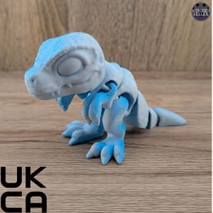 Tiny Poseable Dinosaur Figurine: Pocket Raptor - Cinderwing Design