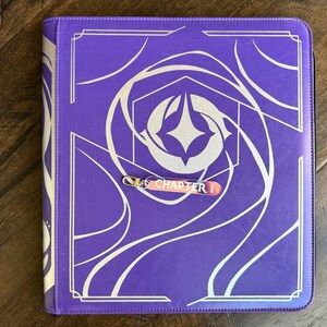 Zipper Pulls to organize Lorcana TCG binders in iridescent color. Chapter 1 with silver clasp is shown