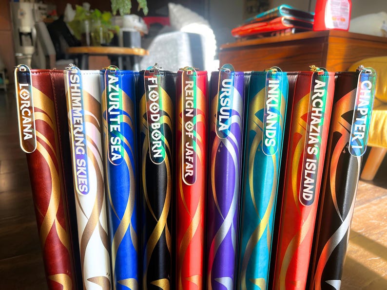Zipper Pulls for all 8 lorcana sets to organize Lorcana TCG binders in iridescent color