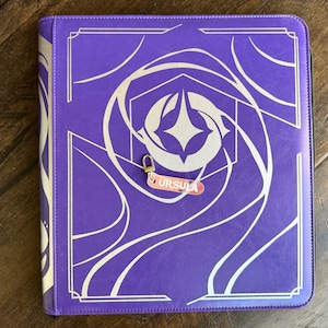Zipper Pulls to organize Lorcana TCG binders in iridescent color. Ursula with silver clasp is shown
