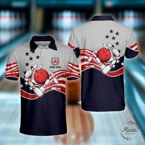 May include: Bowling polo shirt with a patriotic design. The shirt features a red bowling ball and pins, with red and white stripes and blue stars. The text "NAME HERE" is printed on the front.