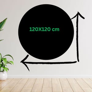May include: A black circle with the text "120X120 cm" in green, with arrows indicating the dimensions. The circle is against a white wall, with a plant in a white pot on the left.