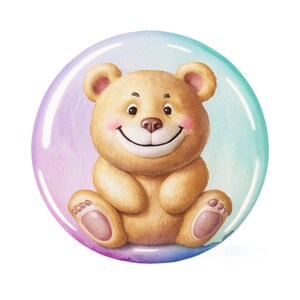 May include: A watercolor illustration of a smiling teddy bear inside a bubble. The bear is light brown with pink accents on its ears, cheeks, and paws. The bubble has a gradient of purple, blue, and green colors.