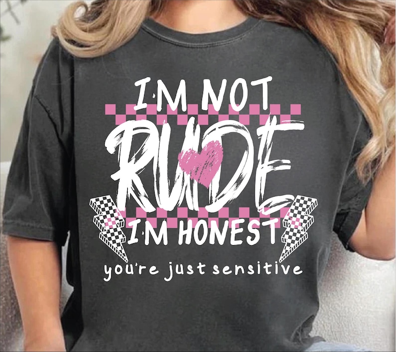 May include: A black t-shirt with a pink and white graphic that says "I'm not rude I'm honest you're just sensitive".