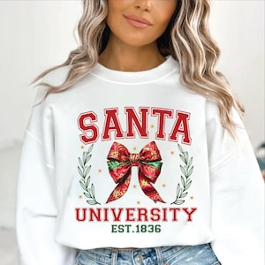 May include: White sweatshirt with red text that says "SANTA UNIVERSITY EST. 1836" and a red and green bow with gold stars.