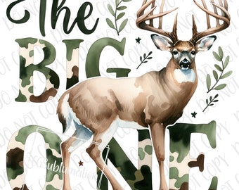 May include: The words "The Big One" are written in green letters with a camouflage pattern. A watercolor illustration of a brown deer with large antlers stands in front of the words. The deer is standing on a camouflage pattern.