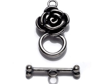 May include: Silver-toned rose-shaped toggle clasp with a matching bar and loop. The clasp is designed for necklaces, bracelets, or other jewelry.