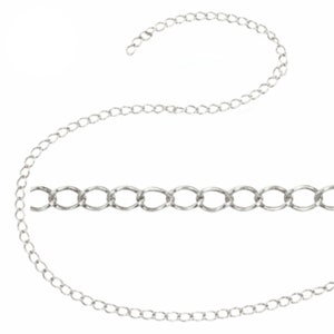 May include: A silver-colored chain with oval links, displayed against a white background. The chain is shown in multiple sections, highlighting its design and flexibility. Ideal for jewelry making or as a necklace.