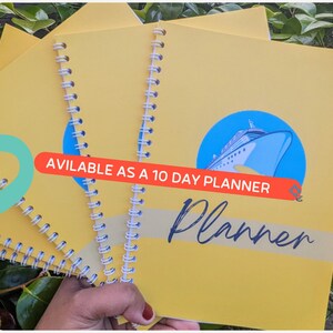 May include: A yellow planner with a cruise ship illustration and the text "Planner" written in cursive. The planner is available as a 10-day planner.