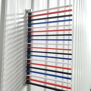 May include: A wall-mounted rack with 18 black, red, white, and blue plastic rods. The rods are numbered 1 through 18.