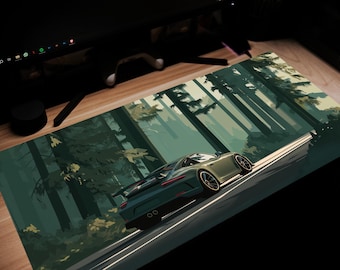 May include: A rectangular desk mat featuring a stylized illustration of a green sports car driving on a road through a forest. The car is angled, with the forest and road in the background. The mat is designed for use with a computer.