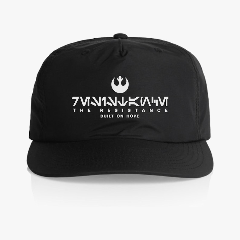 May include: Black baseball cap with a white Rebel Alliance symbol and the text "THE RESISTANCE BUILT ON HOPE" in Aurebesh script.