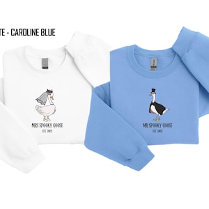 Our "MR & MRS SILLY GOOSE" matching sweatshirts are the perfect way to celebrate love with a side of humor. Featuring hand-drawn, adorable geese (complete with veil and all!) and the cute title “Silly Goose,” these cozy sweaters are sure to bring smiles wherever you go.