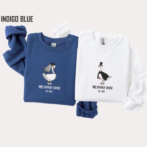 Our "MR & MRS SILLY GOOSE" matching sweatshirts are the perfect way to celebrate love with a side of humor. Featuring hand-drawn, adorable geese (complete with veil and all!) and the cute title “Silly Goose,” these cozy sweaters are sure to bring smiles wherever you go.