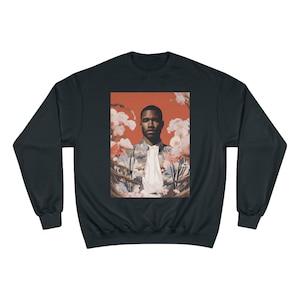 May include: Black sweatshirt with a graphic print of a man with a floral background. The man is wearing a white shirt and a patterned jacket. The background is a red and orange color.