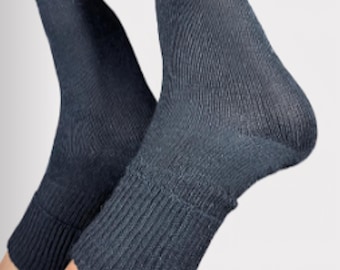 May include: A pair of dark navy blue socks. The socks have a ribbed design and a folded cuff at the ankle. They are made from a soft, comfortable material. The background is plain white.