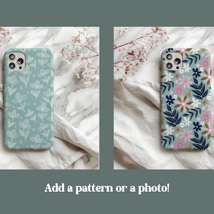 May include: Two phone cases with different floral patterns. The case on the left has a light blue background with white floral designs. The case on the right has a light blue background with pink, white, and blue floral designs.