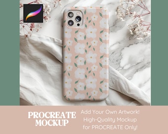 Peut inclure: Une coque de téléphone rose avec un motif floral blanc et des feuilles vertes. La coque est conçue pour un téléphone avec un objectif d'appareil photo carré.
