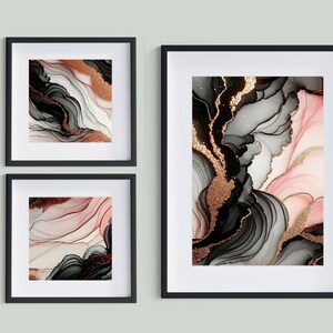 Puede incluir: Tres impresiones enmarcadas en negro con arte abstracto que presenta remolinos negros, blancos, rosados y dorados. El arte recuerda al m&aacute;rmol o al &aacute;gata.