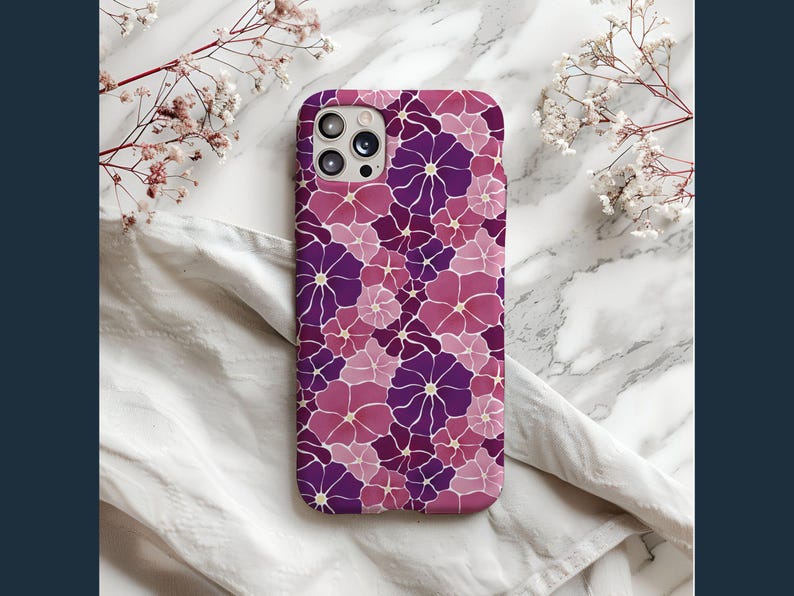 May include: A purple and pink floral phone case with a camera cutout.