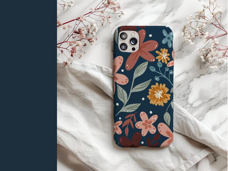 May include: A navy blue phone case with a floral pattern featuring pink, red, and yellow flowers. The case has a camera cutout and a white background.