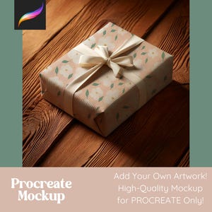 May include: A gift box with a floral pattern and a white satin ribbon. The box is sitting on a wooden surface.