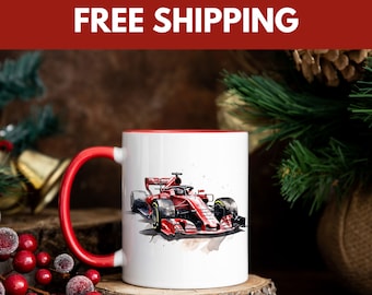 May include: A white ceramic mug with a red rim and handle. The mug features a watercolor illustration of a red Formula 1 race car.