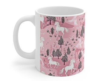 May include: White ceramic mug featuring a pink background with a repeating pattern of white horses running through a forest. The horses are silhouetted against a pink sky and the forest is made up of dark grey trees and pink flowers.