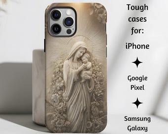 May include: A phone case featuring a detailed relief of Mary holding baby Jesus, surrounded by floral elements. The case is tan and has a matte finish. Text on the side reads "Tough cases for: iPhone, Google Pixel, Samsung Galaxy."