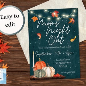 May include: A teal blue invitation with white text that reads "Moms Night Out". The invitation has a fall theme with illustrations of pumpkins, leaves, and string lights. The text also includes the date, time, and location for the event.
