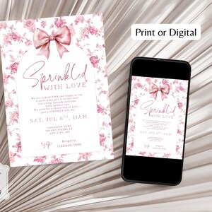 May include: A baby shower invitation with a floral design and a pink bow. The invitation reads "Sprinkled with Love" and includes event details. A smartphone displays the same invitation.
