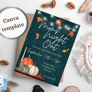May include: A teal blue invitation with white text that reads "Mom's Night Out" with a string of lights and fall leaves. The invitation also includes the date and time of the event, "September 27th 6-10pm", and a location name, address, and zip code. The invitation is decorated with a watercolor illustration of pumpkins and fall leaves.