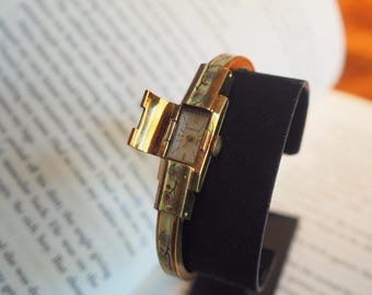 Zegarek damski Gübelin Swiss z ukrytą tarczą, emalią Cloisonné, bransoletka z lat 50. XX wieku
