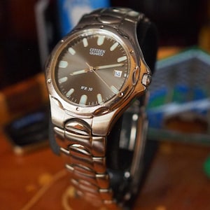 Citizen Quartz WR50 Men's Watch | Black Sunburst Dial, Luminous Markers, Steel Bracelet