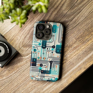 May include: A white phone case featuring a blue and orange circuit board design. The case has a raised camera bump with three lenses.